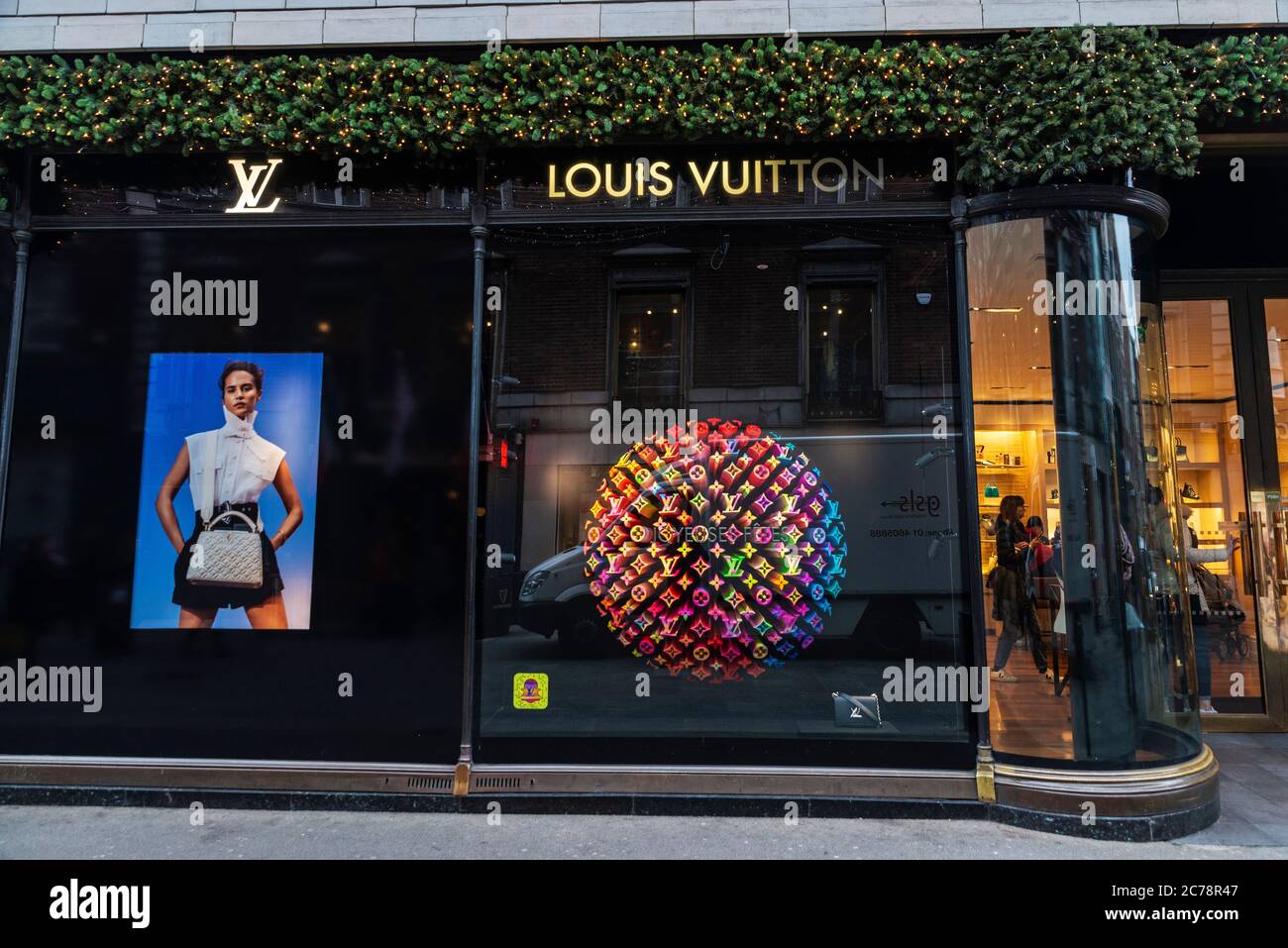 Moscow, Russia - December 1, 2019: Louis Vuitton storefront, multicolored  rainbow background backdrop design, glasses scarf and two bags with a logo.  Bright hologram fluorescent color – Stock Editorial Photo © OlaKorica  #327143390