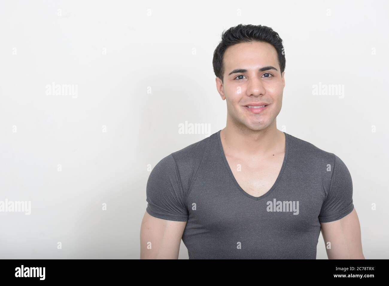 Portrait of young handsome man against white background Stock Photo - Alamy