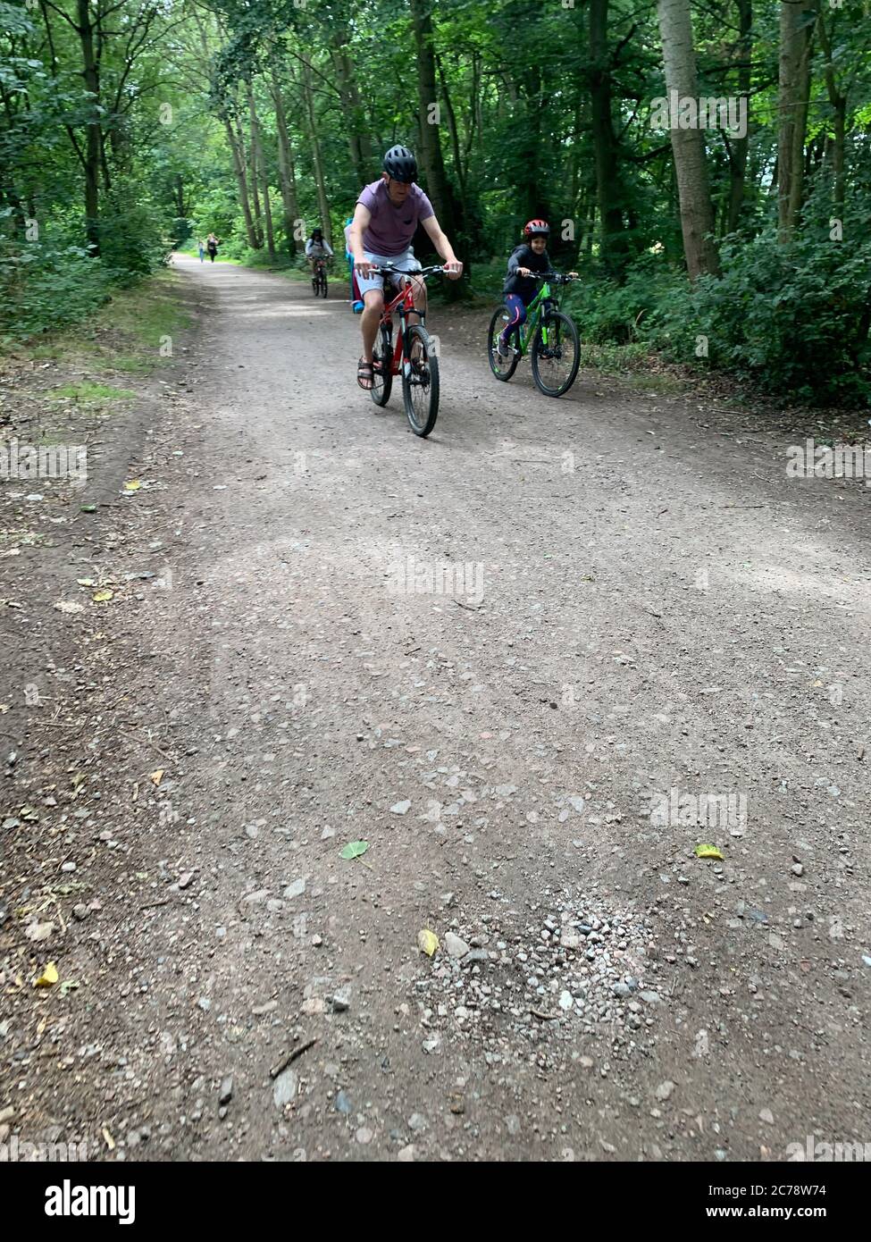 Father and son cycling in Epping Forest, London Stock Photo