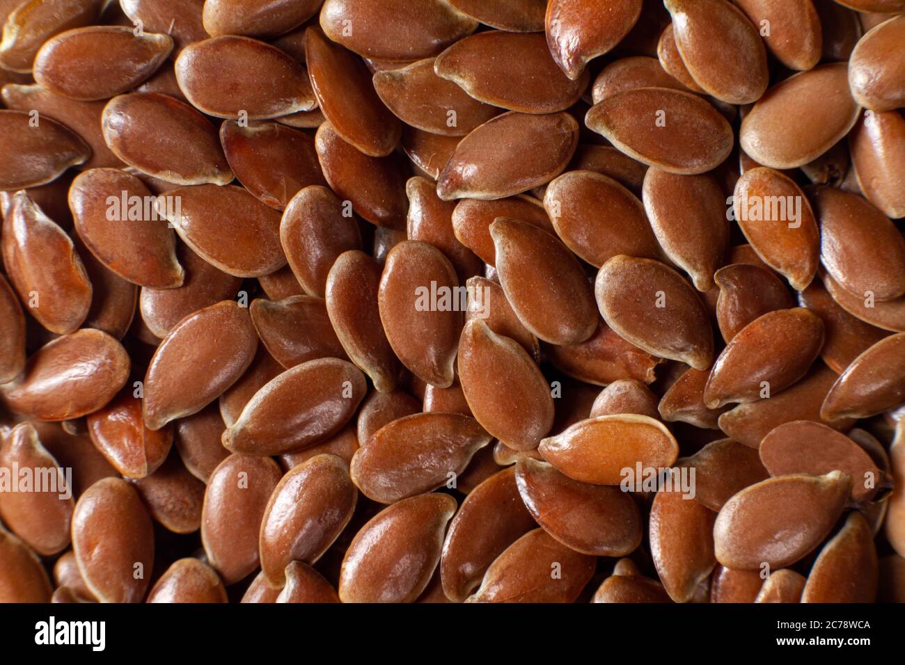 Macro photo flax seeds a source of omega 3, fiber and healthy fats. Brown seeds superfoods