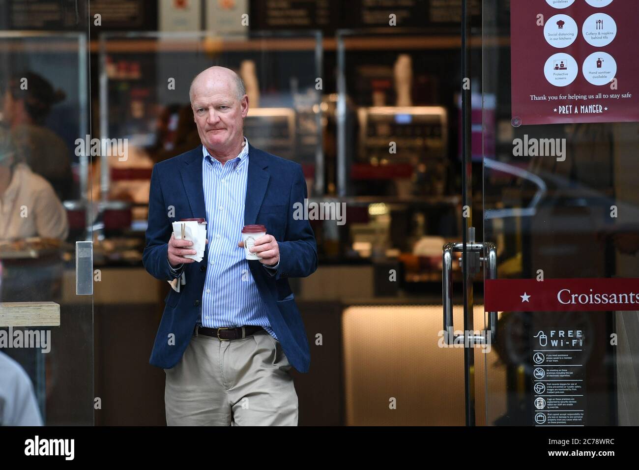 Lord David Willetts, a member of the House of lords, leaves a branch of Pret A Manger in Westminster, London. Wearing face masks in shops will become mandatory from July 24, and Health Secretrary Matt Hanock has denied their is confusion surrounding the new rules. Stock Photo