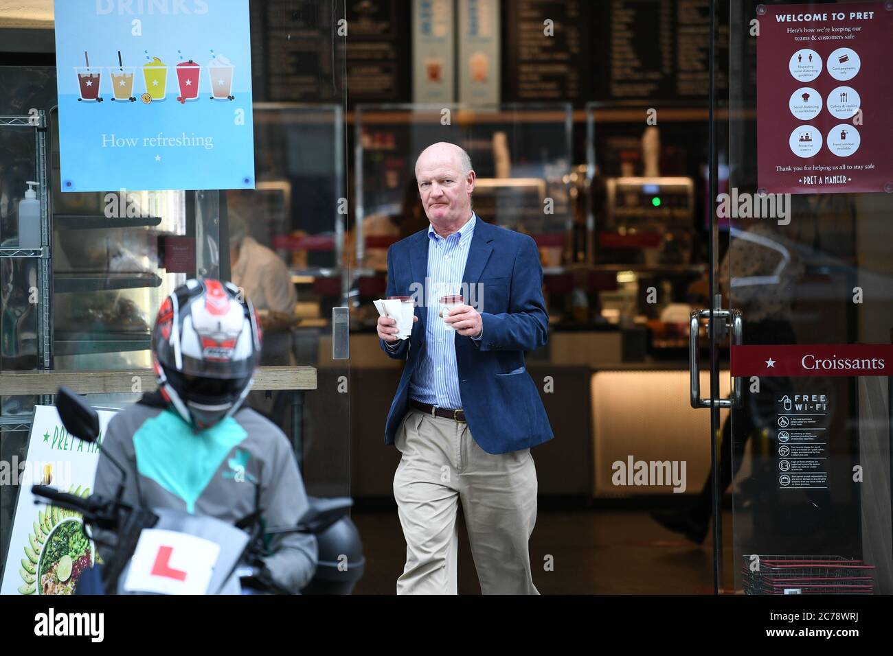 Lord David Willetts, a member of the House of lords, leaves a branch of Pret A Manger in Westminster, London. Wearing face masks in shops will become mandatory from July 24, and Health Secretrary Matt Hanock has denied their is confusion surrounding the new rules. Stock Photo