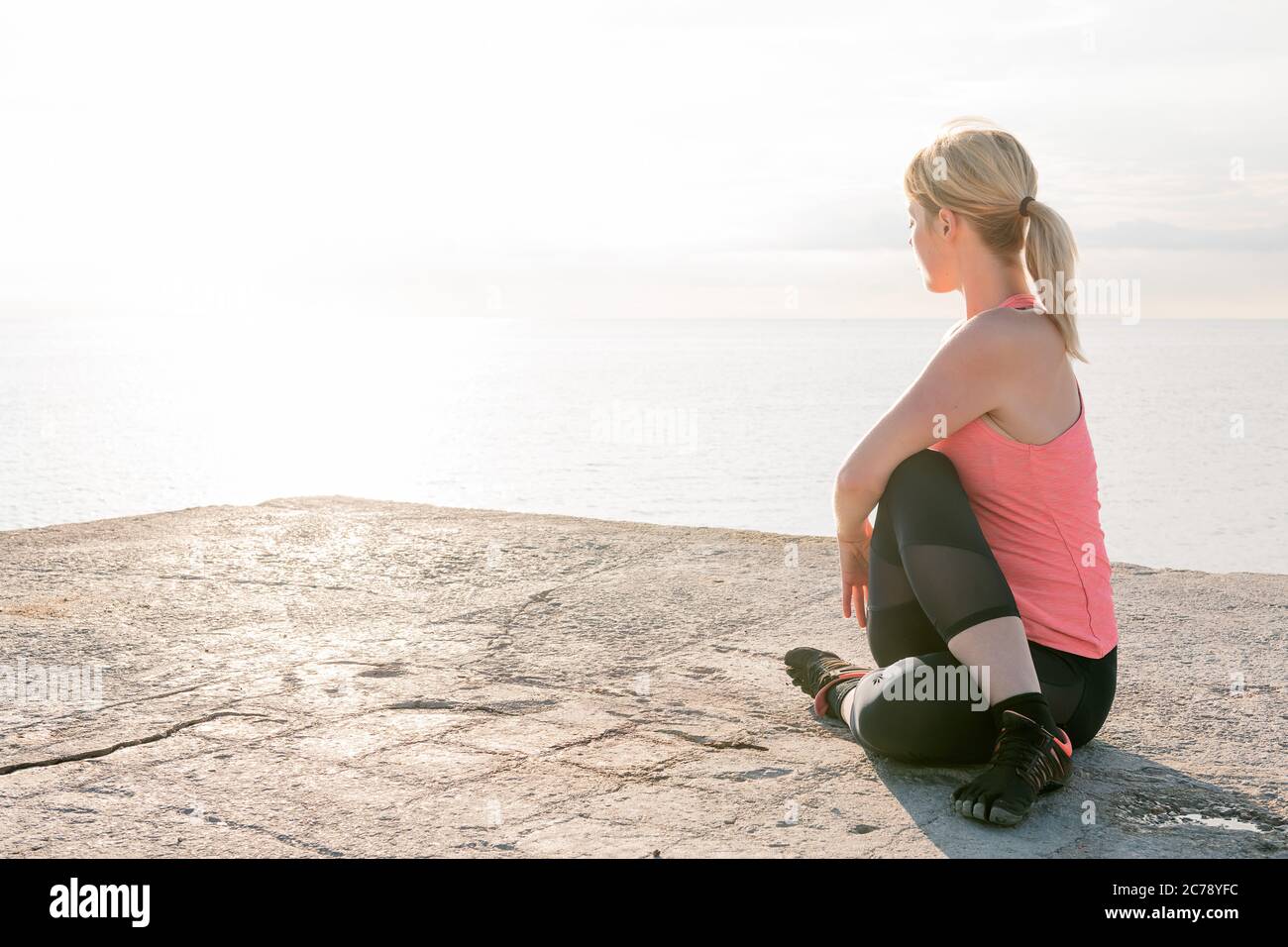 Blonde woman stretching hi-res stock photography and images - Alamy