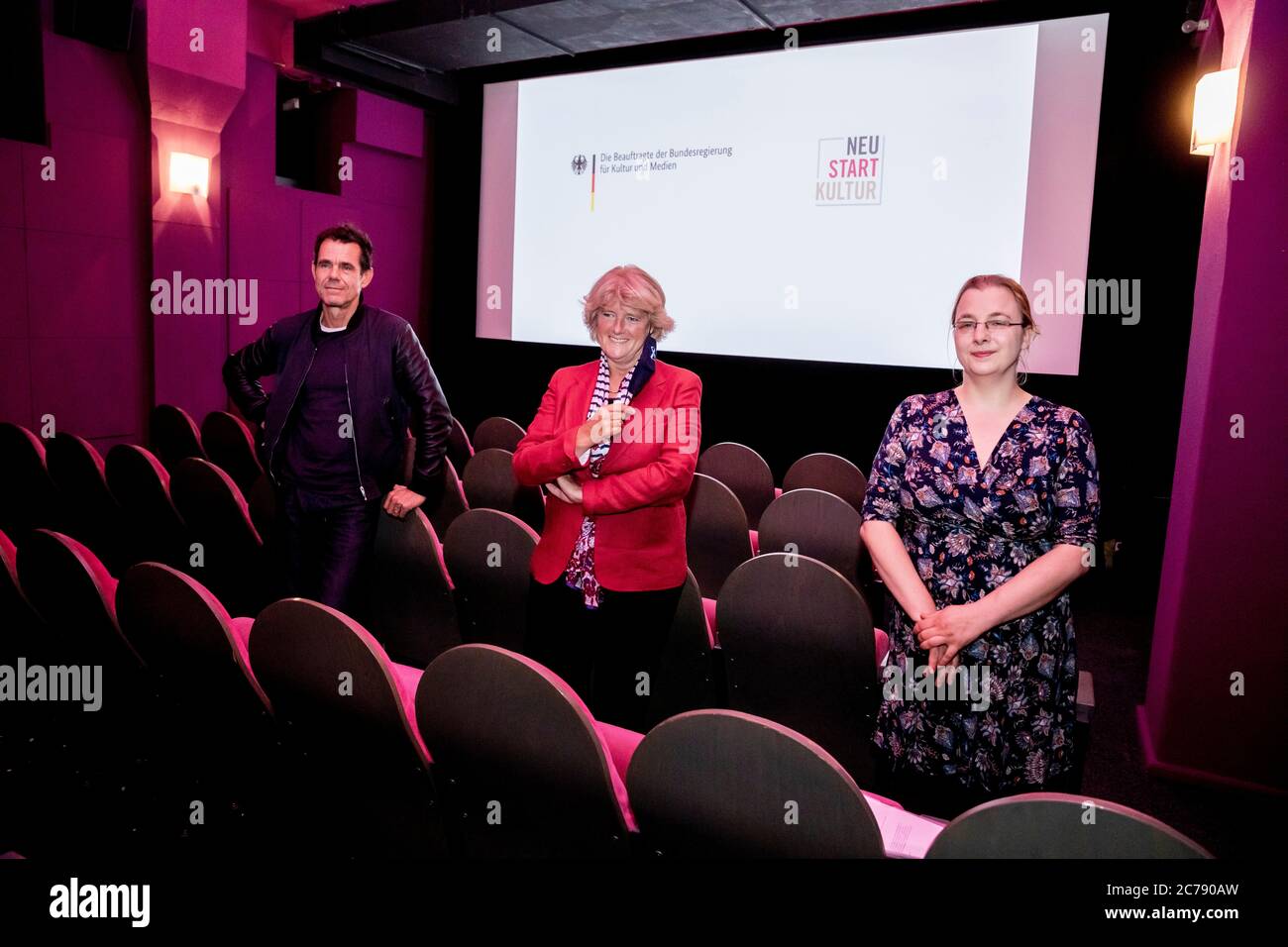 Berlin, Germany. 15th July, 2020. Tom Tykwer (l-r), director, Monika Grütters (CDU), Minister of State for Culture, and Iris Praefke, managing director of the Moviemento cinema, are together for a photo in the Kreuzberg cinema Moviemento at a press event on aid measures for cinemas and the film industry. Credit: Christoph Soeder/dpa/Alamy Live News Stock Photo