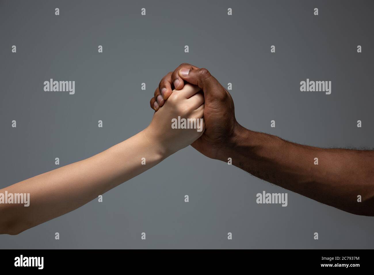 Interracial gifs Supporting, helping. Racial tolerance. Respect social unity. African and  caucasian hands gesturing on gray studio background. Human rights,  friendship, intenational unity concept. Interracial unity Stock Photo -  Alamy