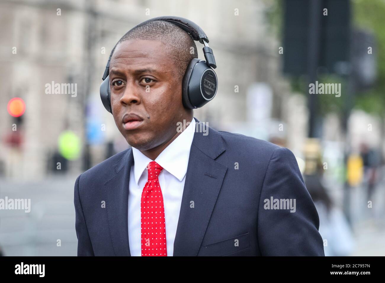 Westminster, London, UK. 15th July, 2020. Conservative MP Bim Afolami walks through the crowd but does not interact. Pro European Anti Brexit protesters and campaigners around Steve (Steven) Bay hold their weekly protest outside the gates at the Houses of Parliament and in Parliament Square, Westminster as MP's hold PMQs inside the House of Commons. Credit: Imageplotter/Alamy Live News Stock Photo