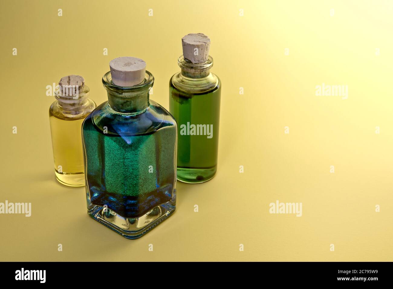 Old bottles with colored liquids Stock Photo