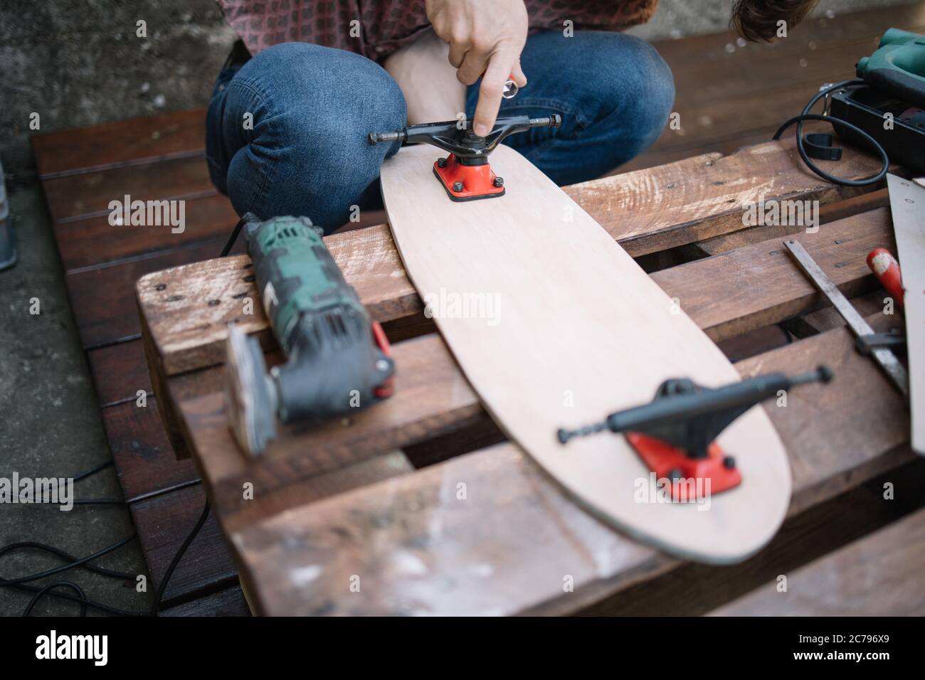 Wooden pallet with skateboard deck, trucks and tools Stock Photo Alamy