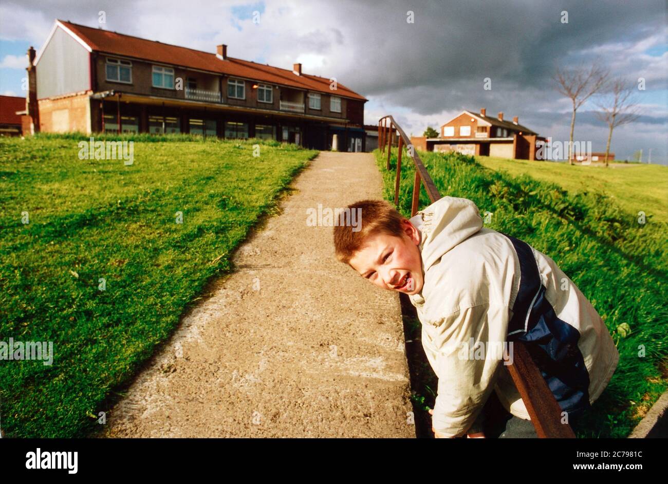 Boy playing on Bradford Housing estate Stock Photo