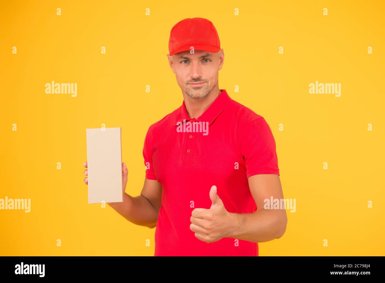 Perfect delivery. Delivery man yellow background. Free services ...