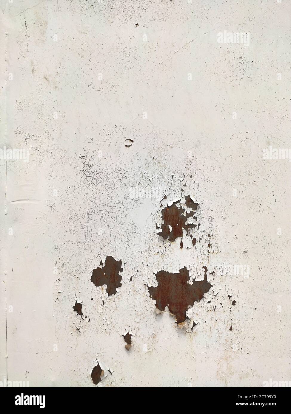 Corroded metal background. Rusted grey painted metal wall. Rusty metal background with streaks of rust. Rust stains. The metal surface rusted spots. R Stock Photo