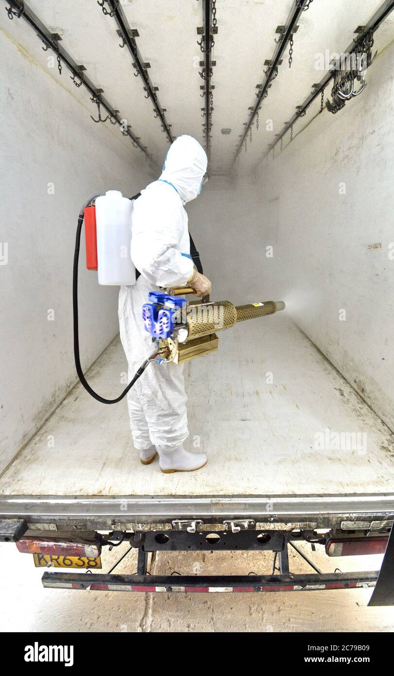 Beijing, China. 15th July, 2020. A staff member disinfects the refrigerated transportation facility at the Beijing Ershang Meat Food Group Co., Ltd. in Beijing, capital of China, July 15, 2020. Beijing Ershang Meat Food Group Co., Ltd. is one of the major companies to supply meat for Beijing market. During the COVID-19 pandemic, the company has taken strict COVID-19 prevention and control measures along the whole supply chain, as a way to ensure meat products safety and regular operation of its processing factories to meet the market demand. Credit: Li Xin/Xinhua/Alamy Live News Stock Photo
