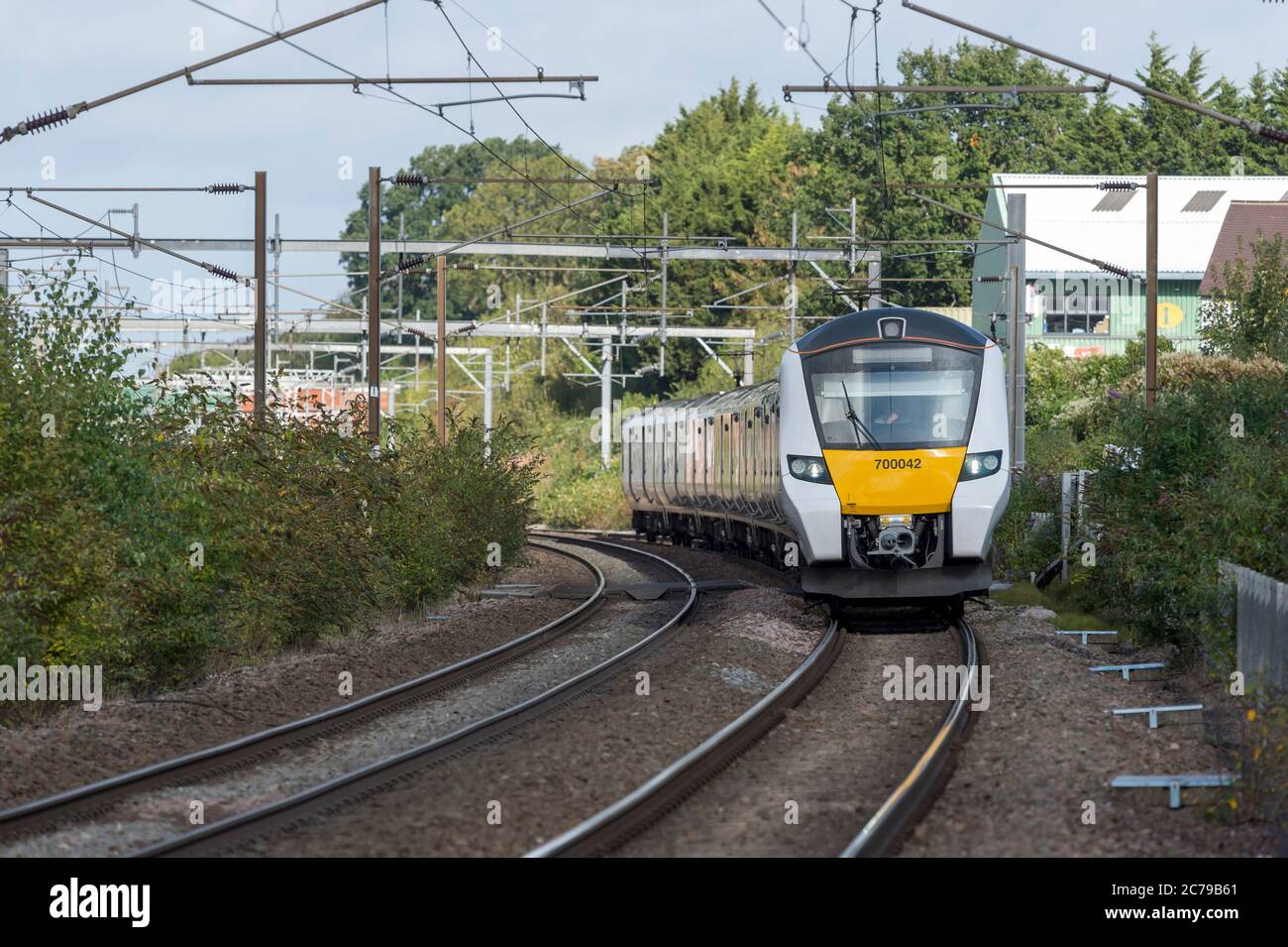 Class 700 passenger train in Thameslink livery travelling in the UK. Stock Photo