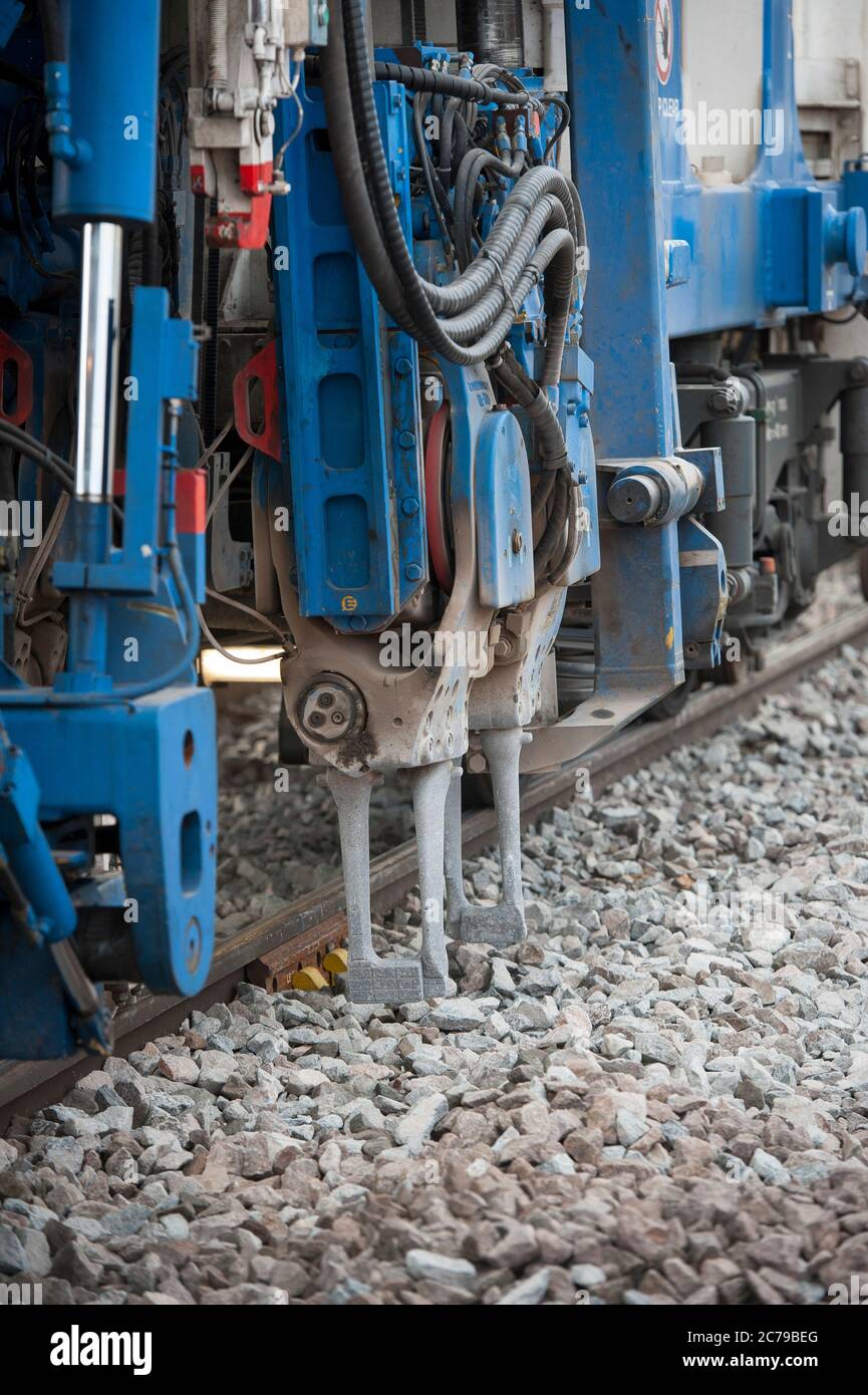 Balfour Beatty tamper working on rail track in the UK Stock Photo Alamy