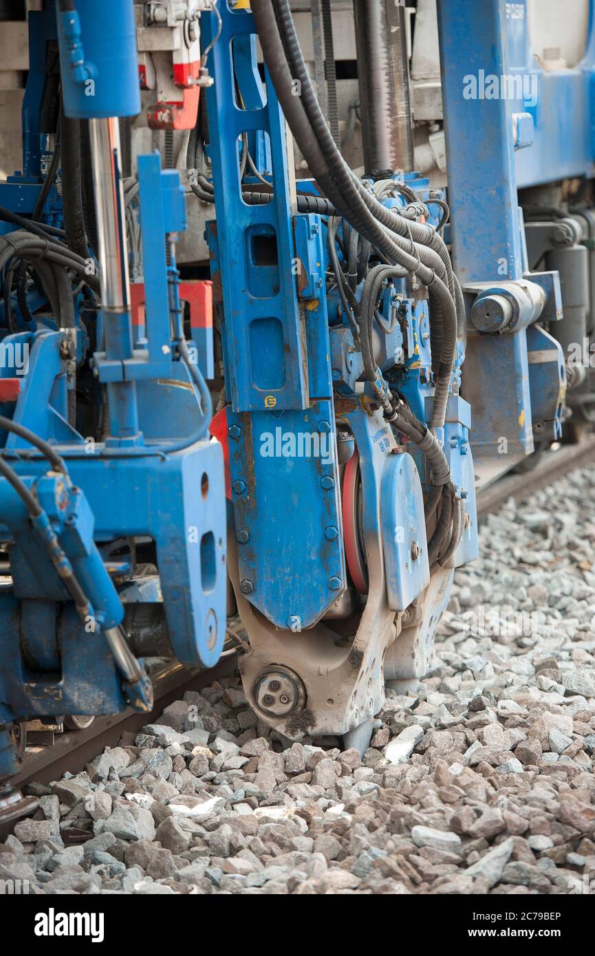 Balfour Beatty tamper working on rail track in the UK Stock Photo Alamy
