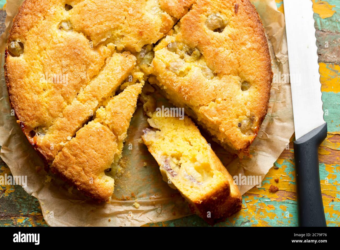 Sticky gooseberry saffron cake with vanilla custard Stock Photo Alamy