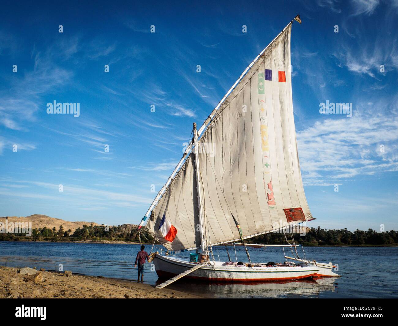 a traditional egyptian sailing boat (feluca) on a beach on river nile near aswan Stock Photo Alamy