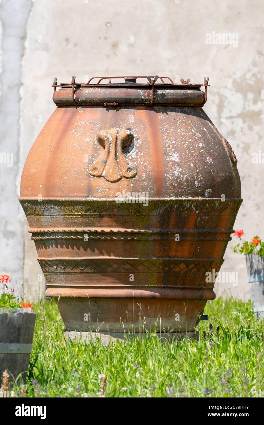 Large earthenware jar in the garden Stock Photo