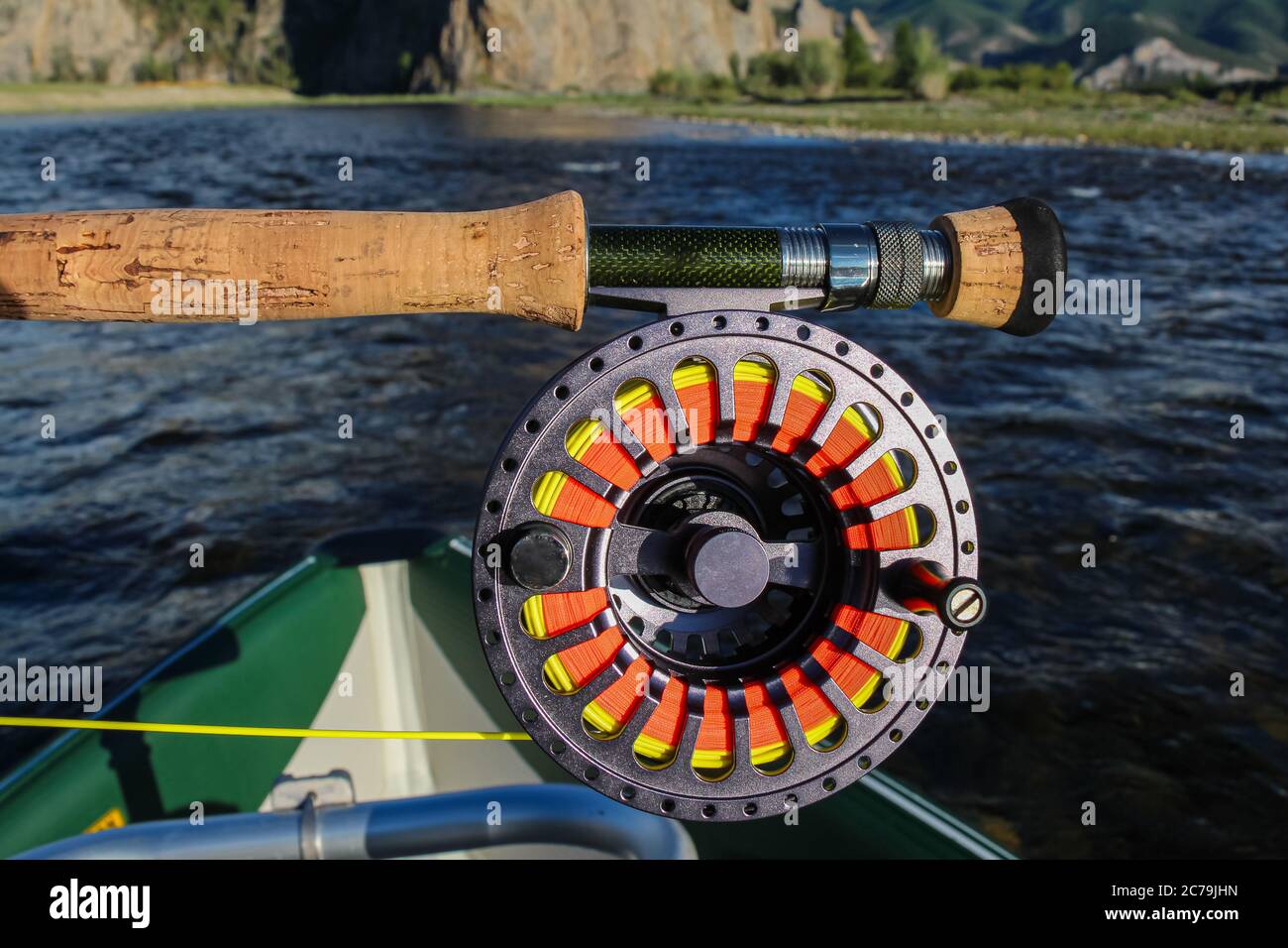 https://c8.alamy.com/comp/2C79JHN/close-up-of-a-fly-fishing-rod-reel-and-fly-line-in-the-late-evening-sun-2C79JHN.jpg