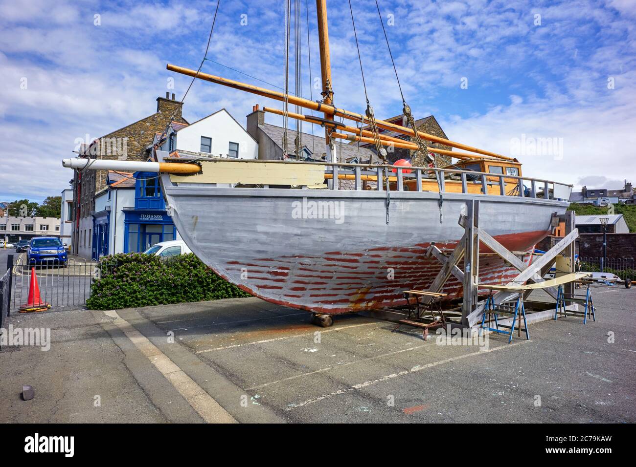 Manx Nobby sailing boat White Heather undergoing repairs on the quayside at Peel harbour in Isle of Man Stock Photo