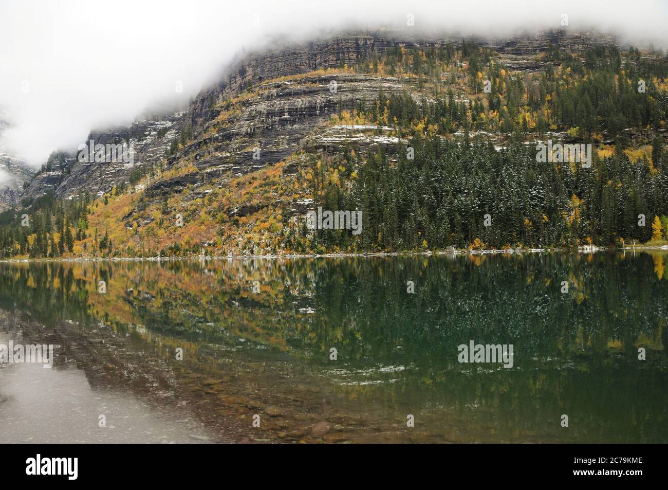 Reflection of Fall Colors at Avalanche Lake in Glacier National Park, Montana Stock Photo