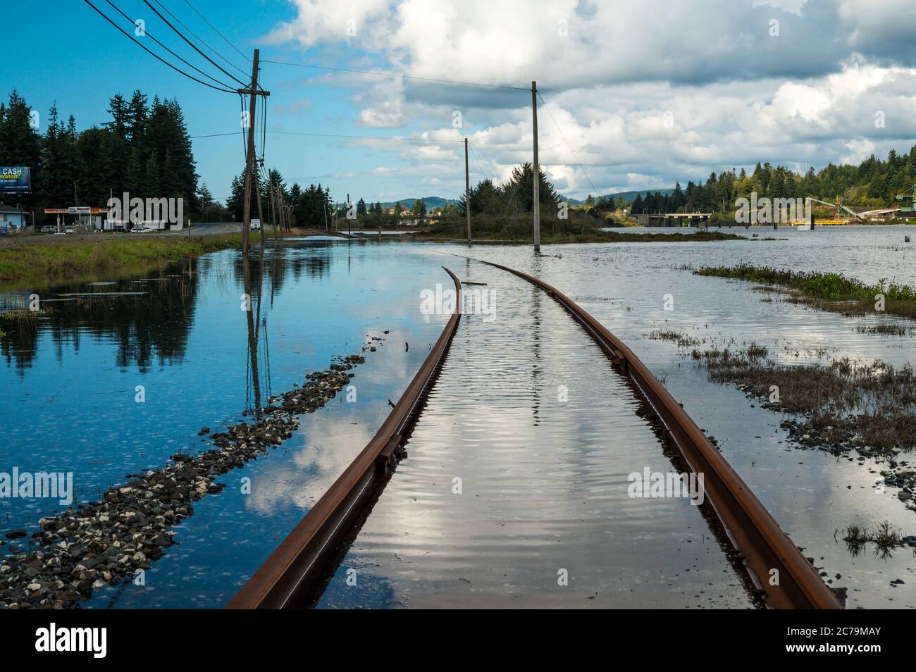 Train tracks in Coos Bay, Oregon under water.  Stock Photo