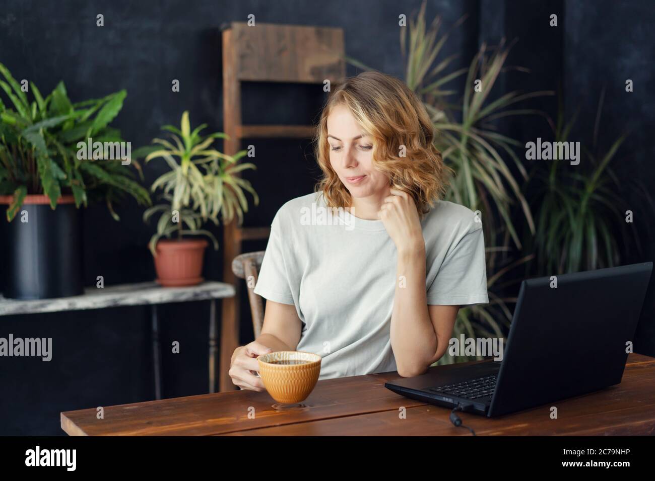 woman with laptop and coffee Stock Photo Alamy