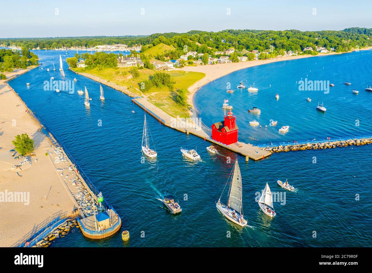 Aerial view of the Holland Harbor Lighthouse, Big Red Lighthouse, at the channel connecting Lake Macatawa with Lake Michigan; Holland State Park Stock Photo