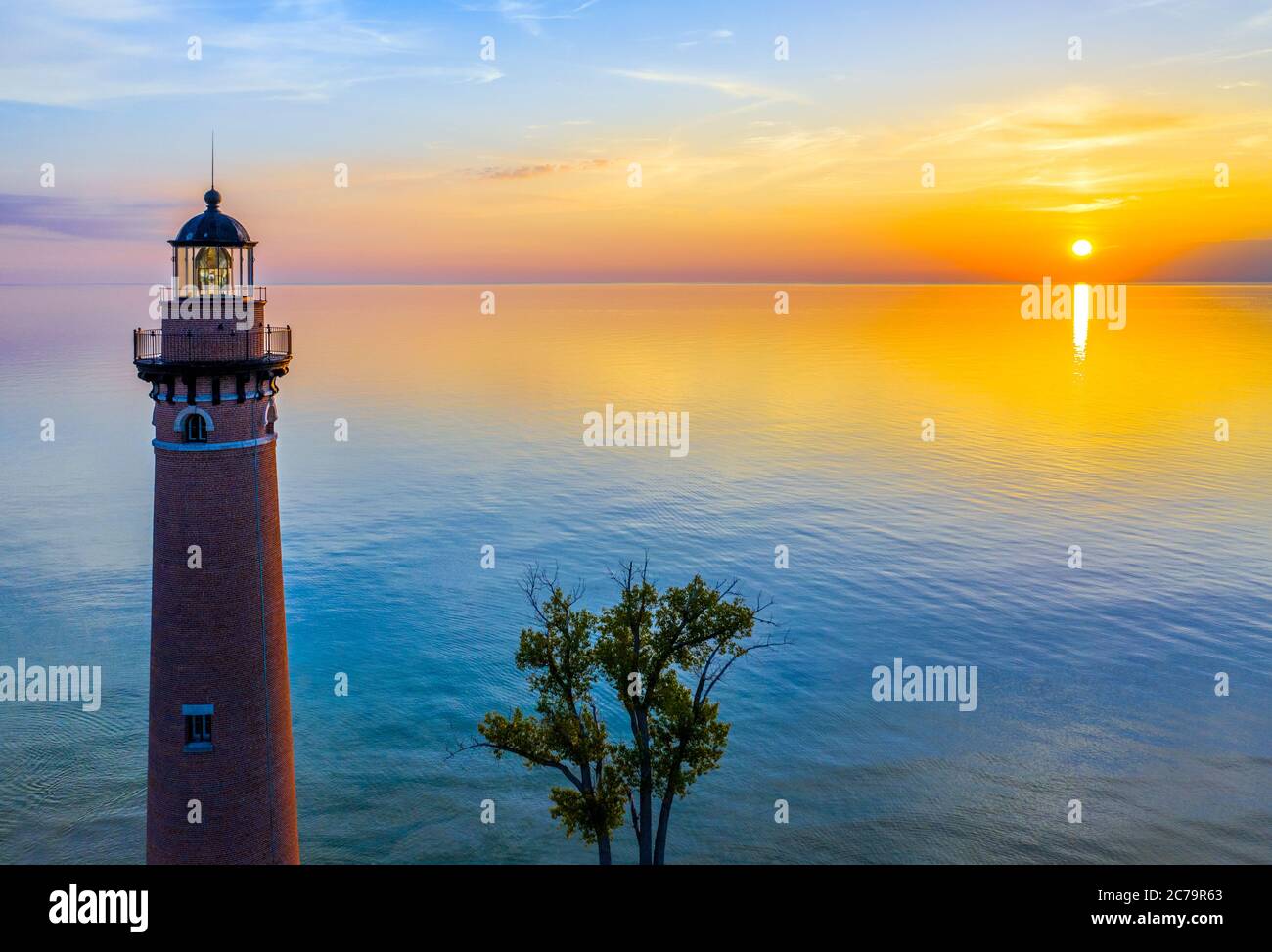 Aerial view of Little Sable Point Lighthouse at sunset over Lake Michigan; Mears, Michigan; Silver Lake State Park Stock Photo