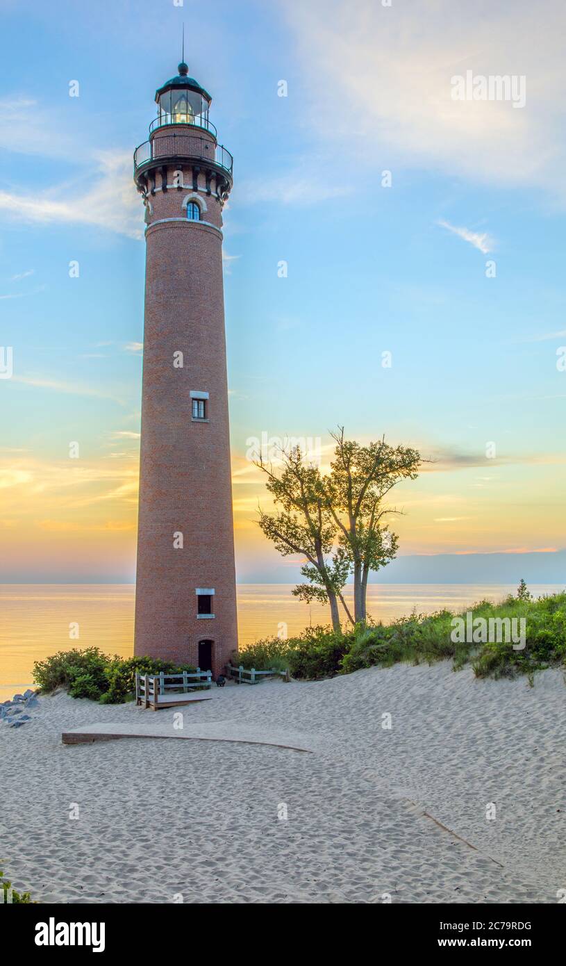 View of Little Sable Point Lighthouse at sunset overlooking Lake Michigan near Mears, Michigan; Silver Lake State Park Stock Photo