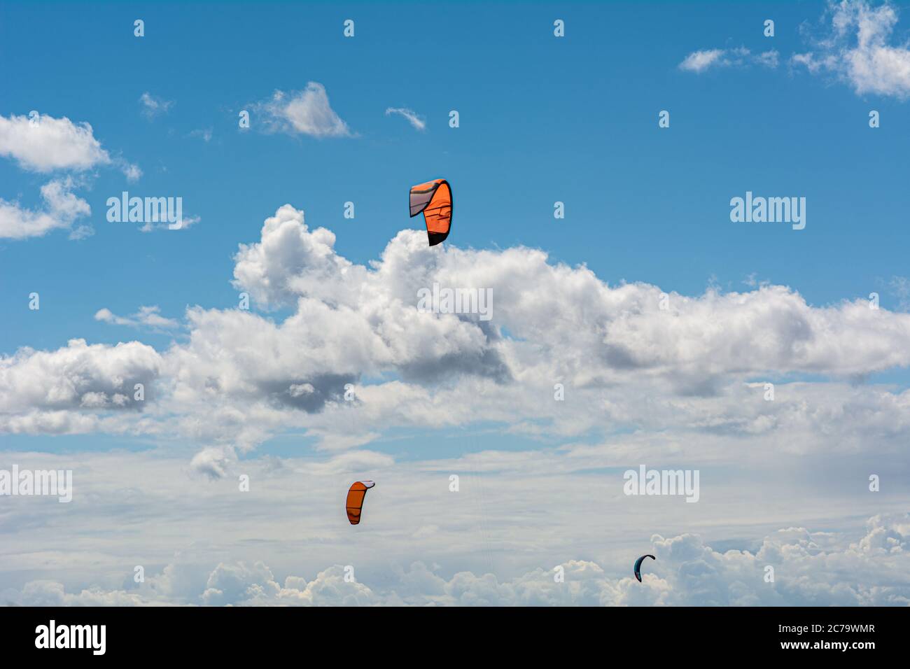 Malmo, Sweden - July 12, 2020: On a windy day many people take the opportunity to do watersports. Kitesurfers gather near Lomma beach to practice their kite surfing skills Stock Photo