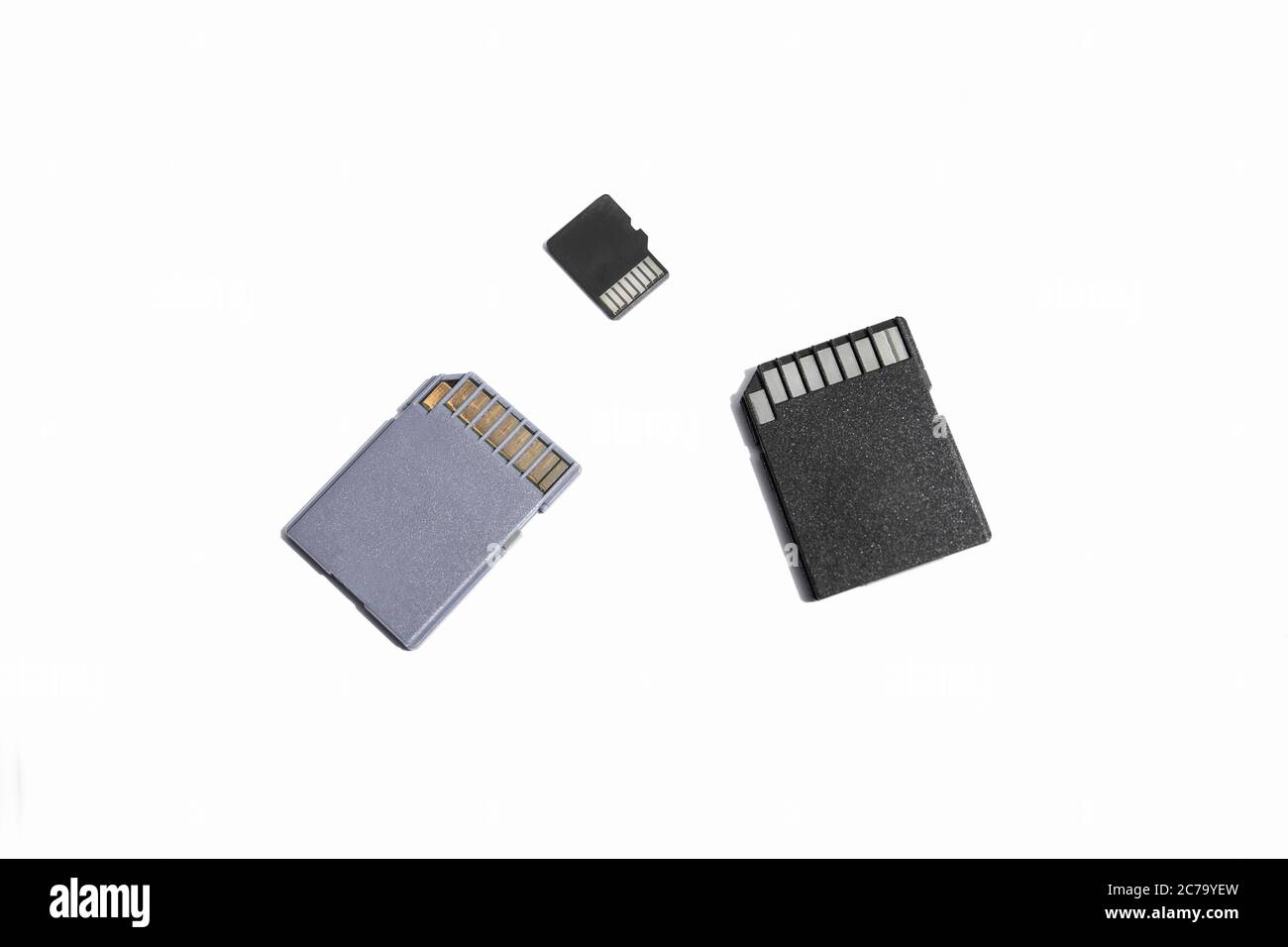 three SD memory cards on a white background, selective focus Stock Photo