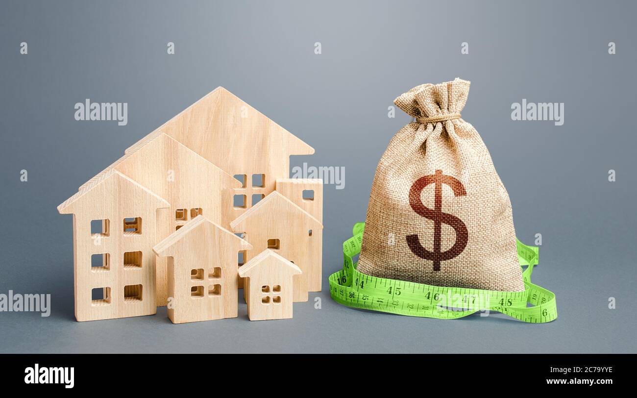 Residential houses and a dollar money bag. Property real estate