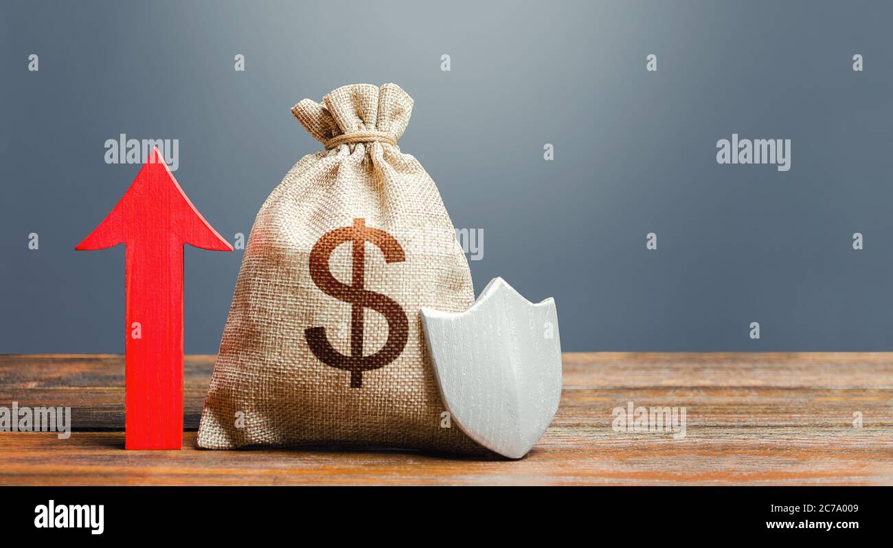 Dollar money bag with a shield and a red arrow up. Increasing the maximum amount of guaranteed insurance compensation for deposits. Safety security of Stock Photo