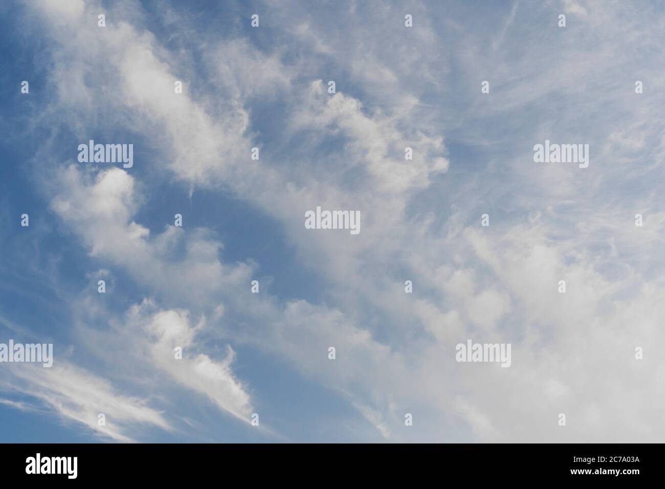 Blue sky and fluffy clouds with copy space Stock Photo - Alamy