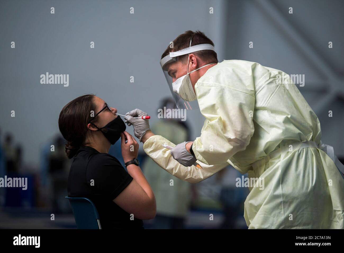 A U.S. Air Force medic takes a nasal swab from an academy cadet on arrival, as they become the first cadet class under the COVID-19 pandemic at the Air Force Academy June 25, 2020 in Colorado Springs, Colorado. Stock Photo