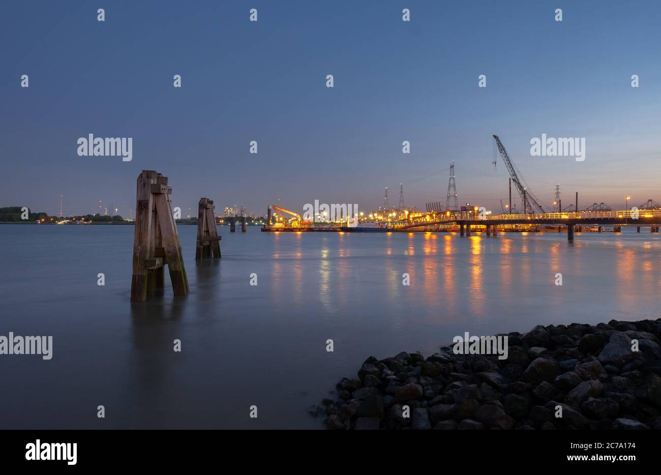 Long exposure image of the jetty of Lillo in the Port of Antwerp. Stock Photo