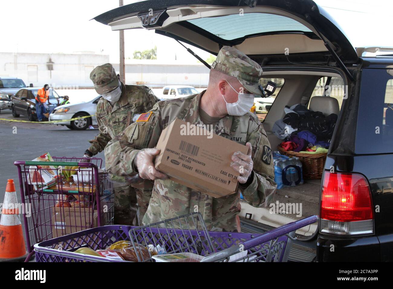 California National Guard soldiers load boxes of food for to assist families in response to COVID-19, coronavirus pandemic at the Stockton/San Joaquin Emergency Food Bank June 26, 2020 in Stockton, California. Stock Photo