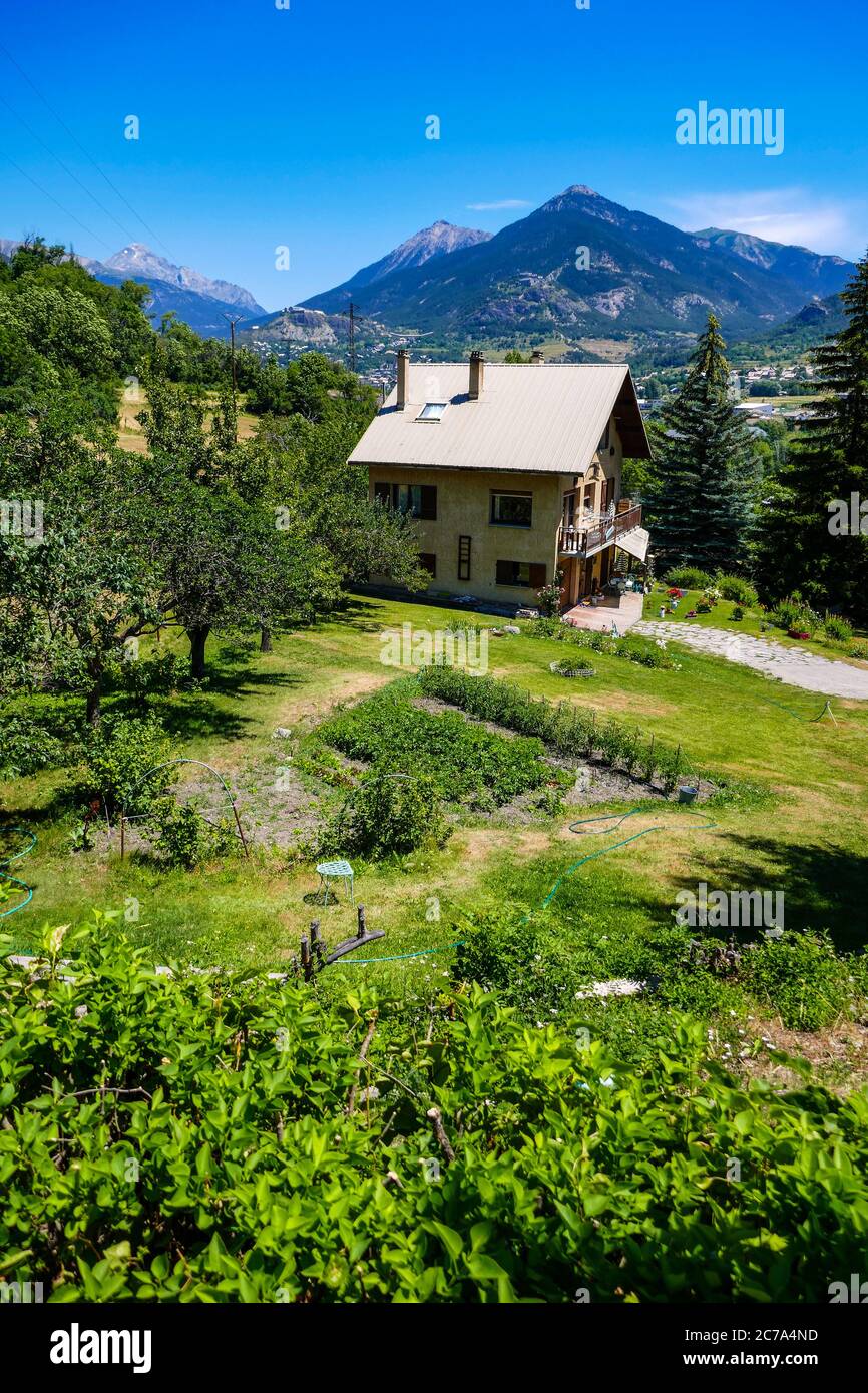 Large house with vegetable garden and fruit trees, Briancon, Ecrins, France Stock Photo