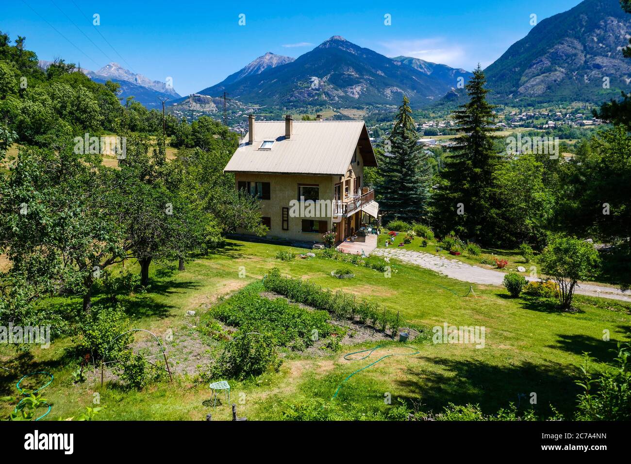 Large house with vegetable garden and fruit trees, Briancon, Ecrins, France Stock Photo