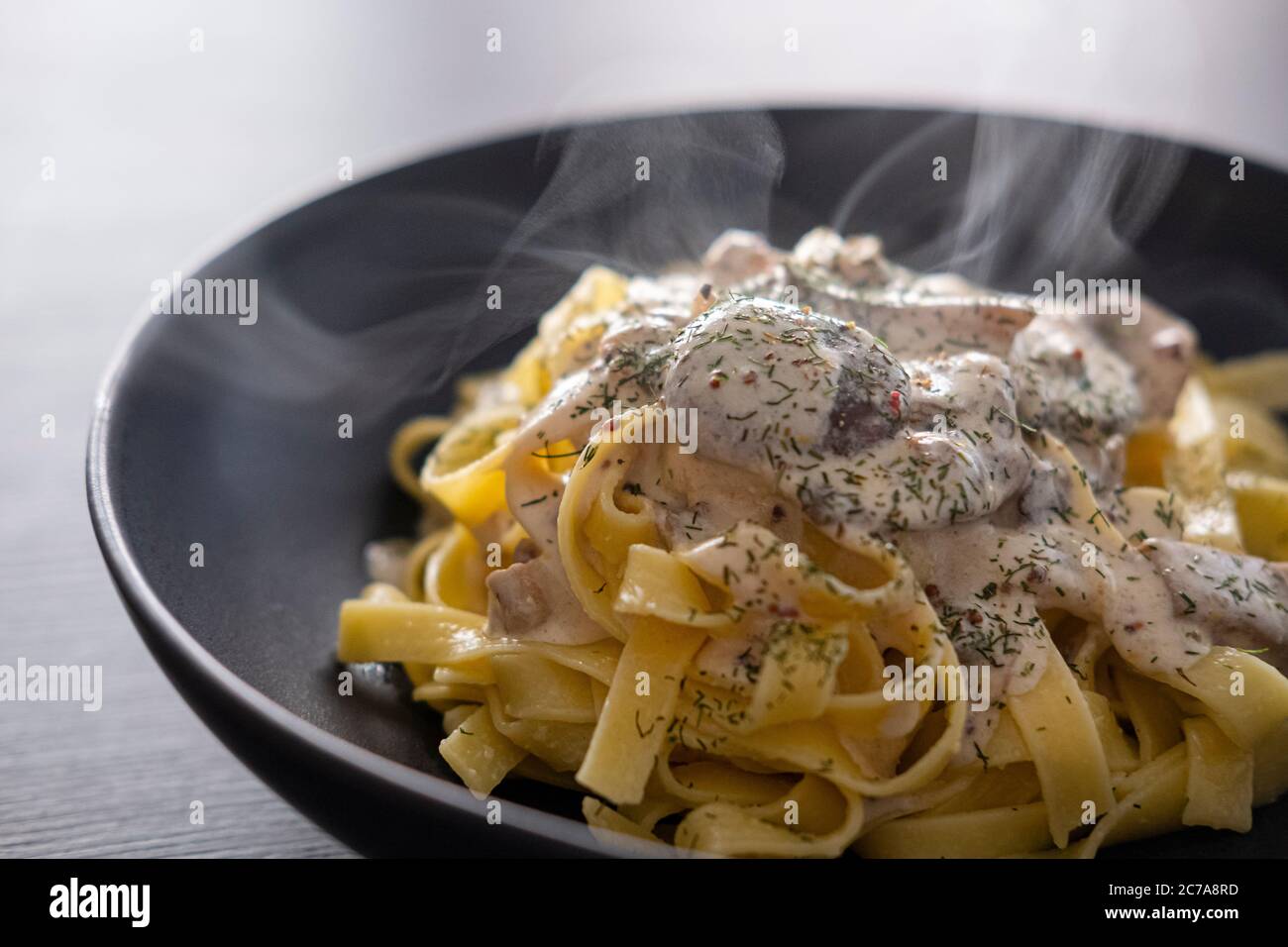 Tagliatelli with mushrooms and stroganoff sauce Stock Photo