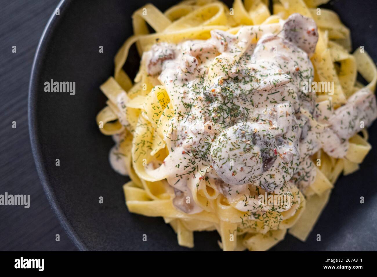 Tagliatelli with mushrooms and stroganoff sauce Stock Photo