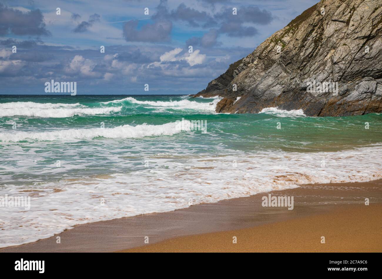 Waves off Holywell Beach Stock Photo