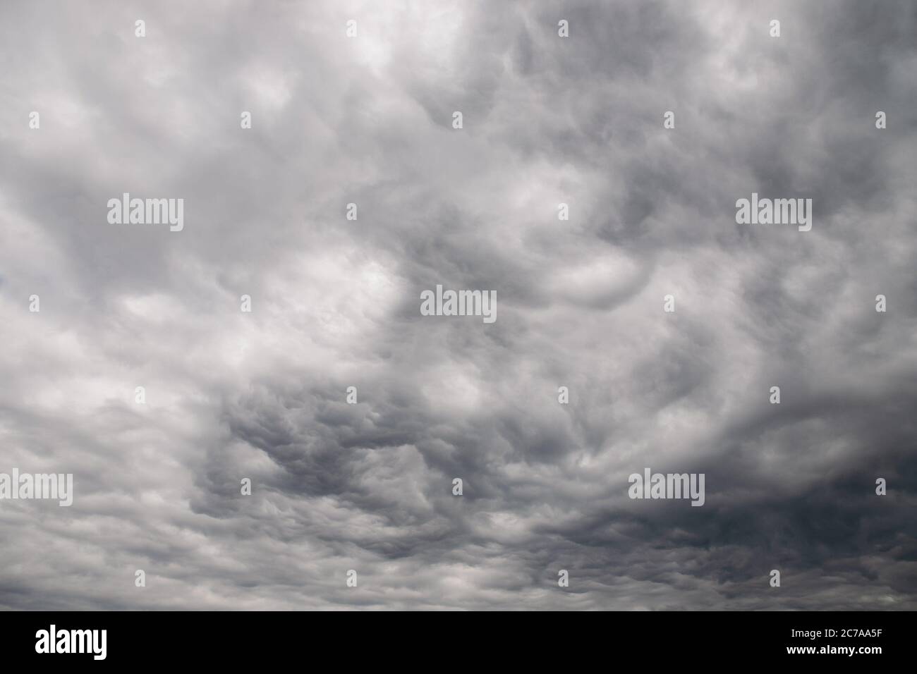 Dramatic gray clouds in the rainy sky Stock Photo