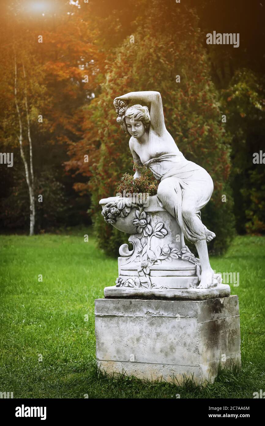 Vintage angle woman statues in a park. Selective focus Stock Photo - Alamy