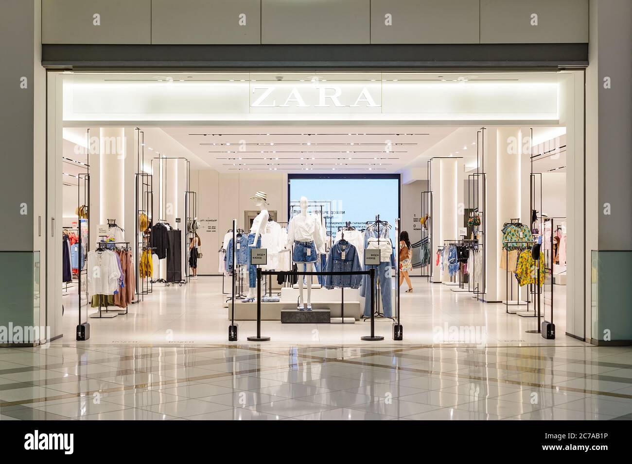 Varna, Bulgaria, July 11, 2020. Signboard of Zara logo above the entrance  to brand store in the Grand Mall. Interior with fashionable summer clothes  Stock Photo - Alamy