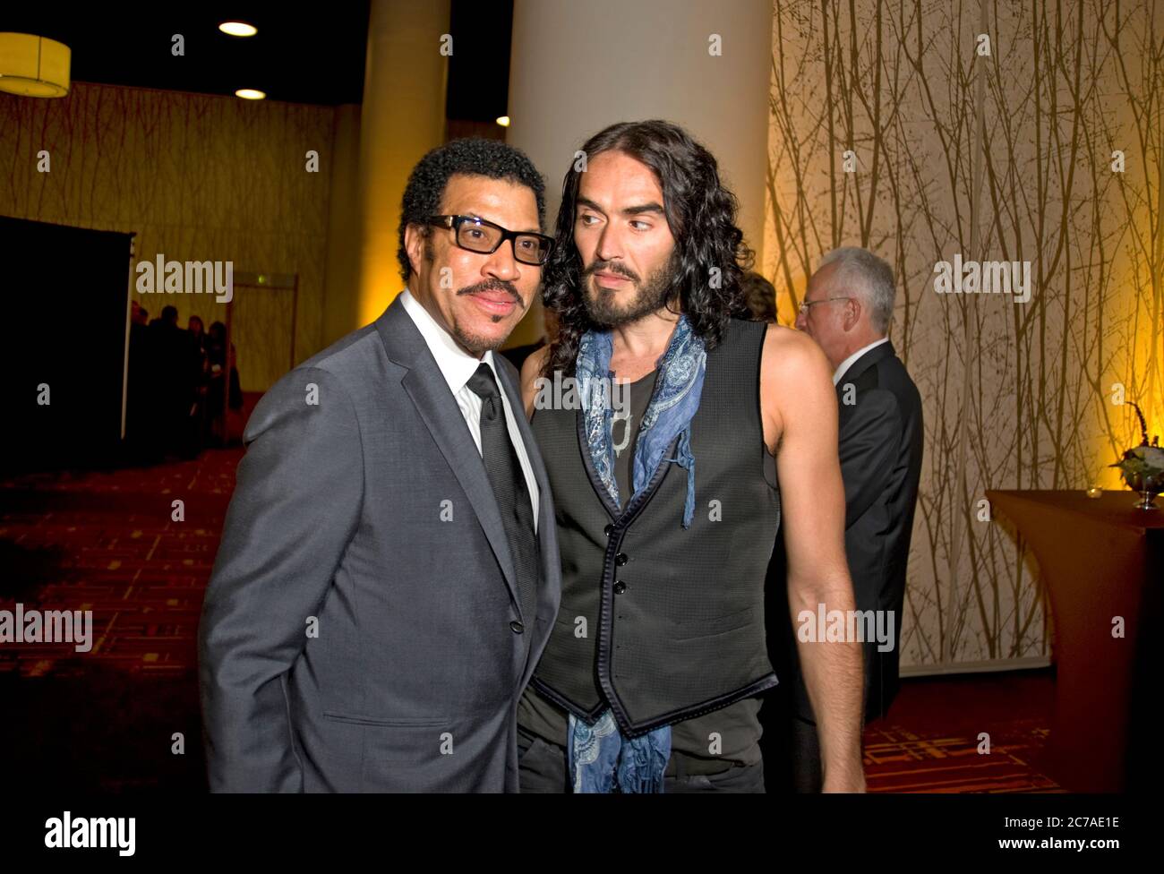 Lionel richie greets Russel Brand at the premiere party for Mexico The Royal Tour screening in Los Angeles 9/21/11 Stock Photo
