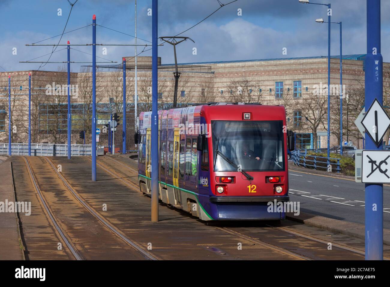 Midland Metro Ansaldo T69 tram 12 at The Royal, Wolverhampton running along the streets. Stock Photo