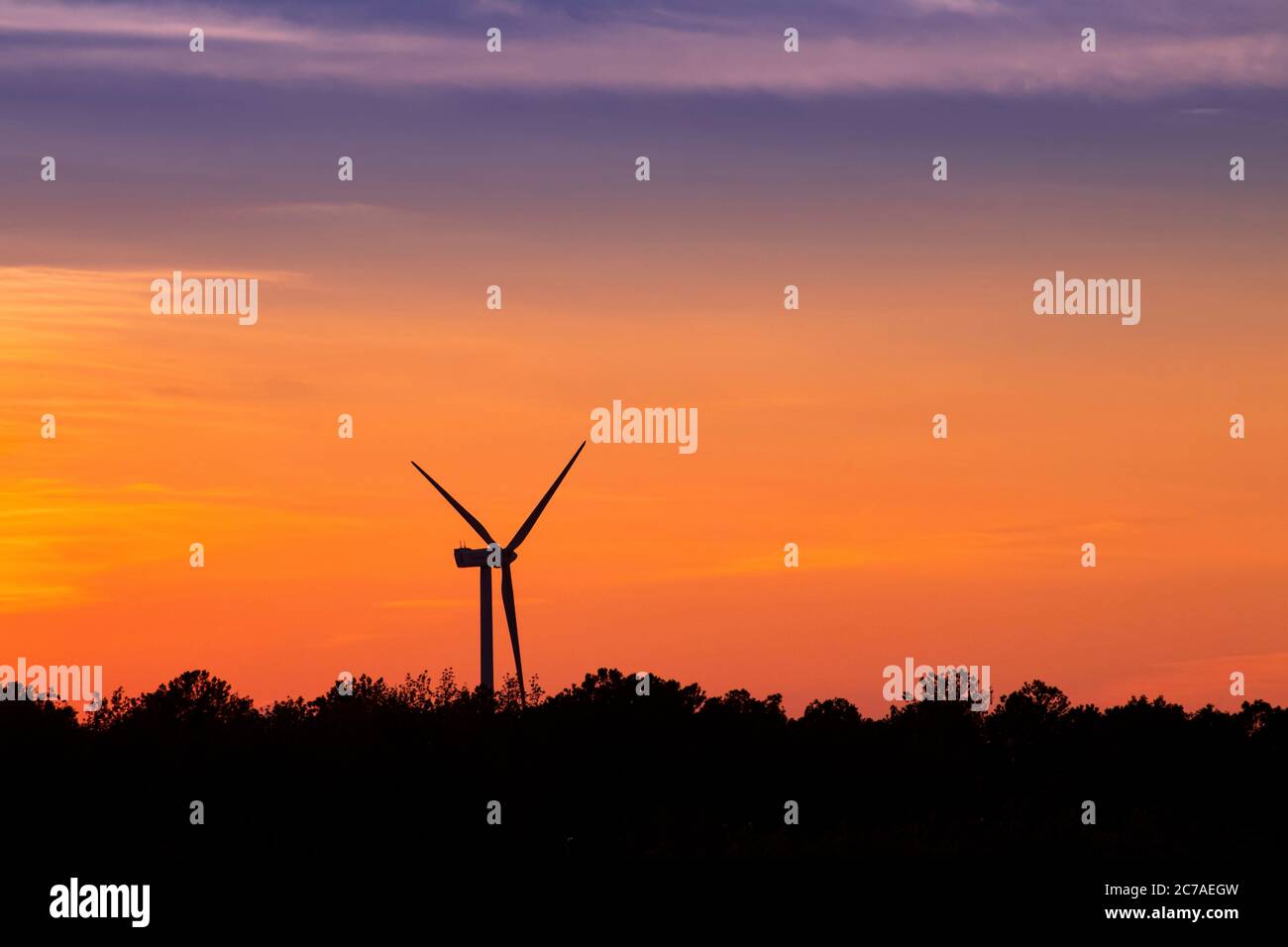 Silhouette of wind turbine at sunset, Delaware USA Stock Photo