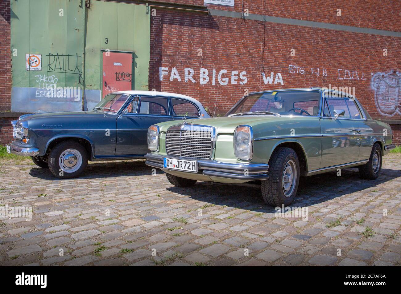 Borgward Isabella TS and Mercedes Coupè in Bremen Harbour District Stock Photo